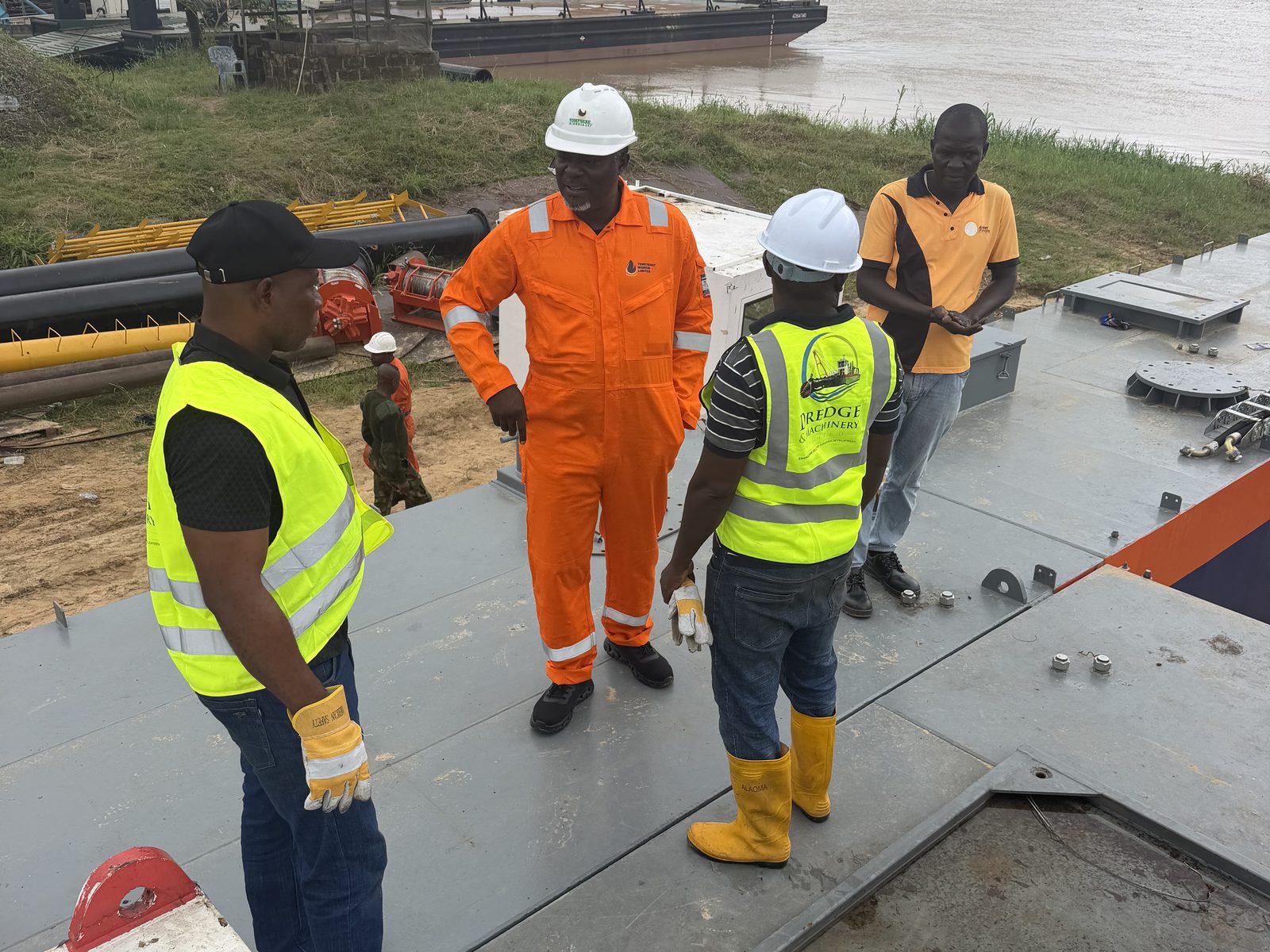 Tompsebet crew inspecting the deck of a newly built dredger